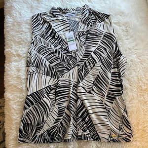 Calvin Klein top. With tags. Size Large. Never worn.